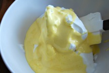 Fold the egg yolk mixture and whites together.