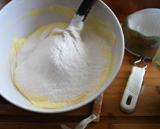 Sift flour into yolk and whites mixture then fold gently.